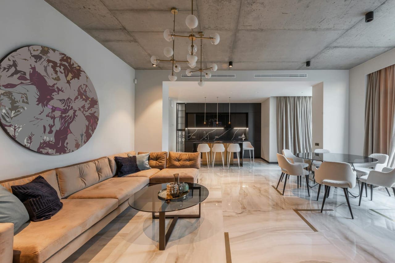 Modern open-plan living interior with warm furniture and clear spatial flow.