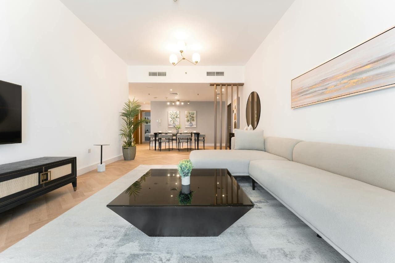 Luxury double-height portfolio interior used as a consultation backdrop.