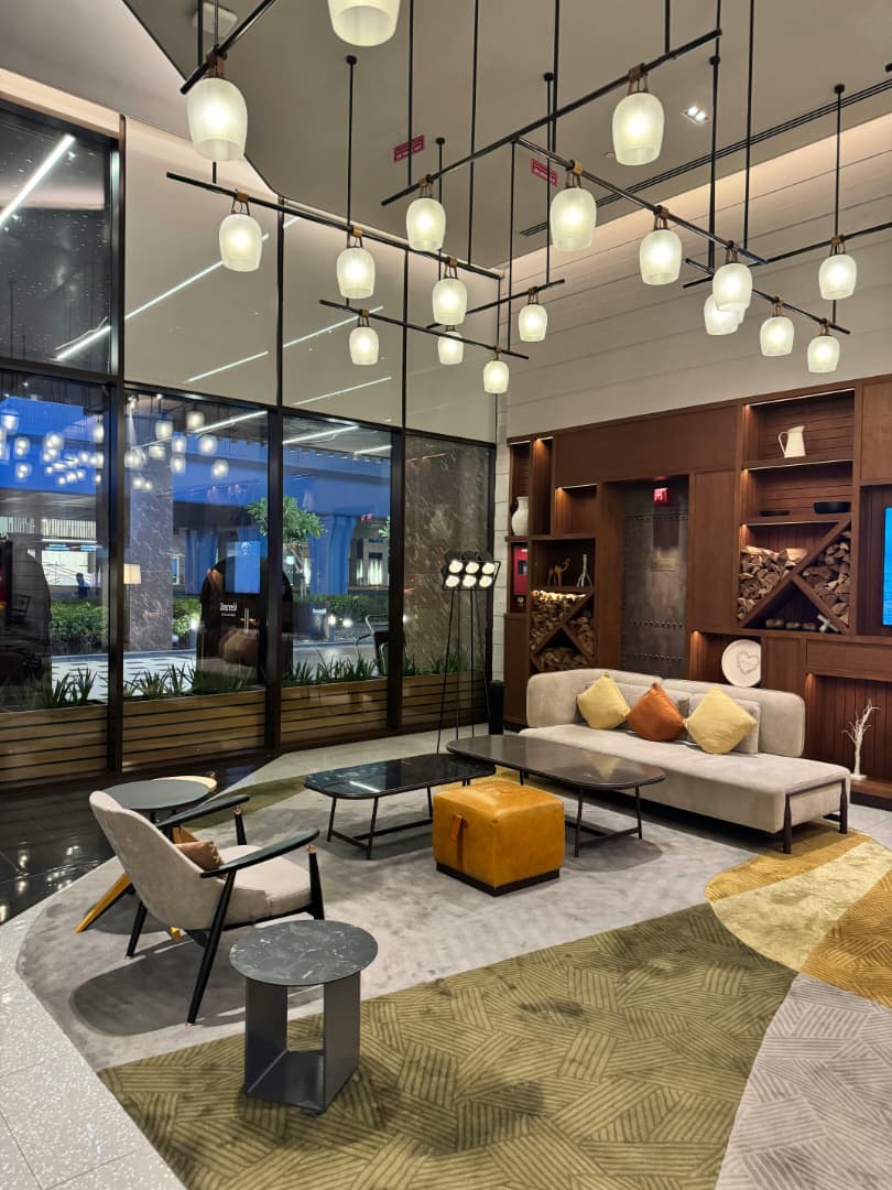 Bespoke lounge styling with curated furniture, lighting, and refined decor.