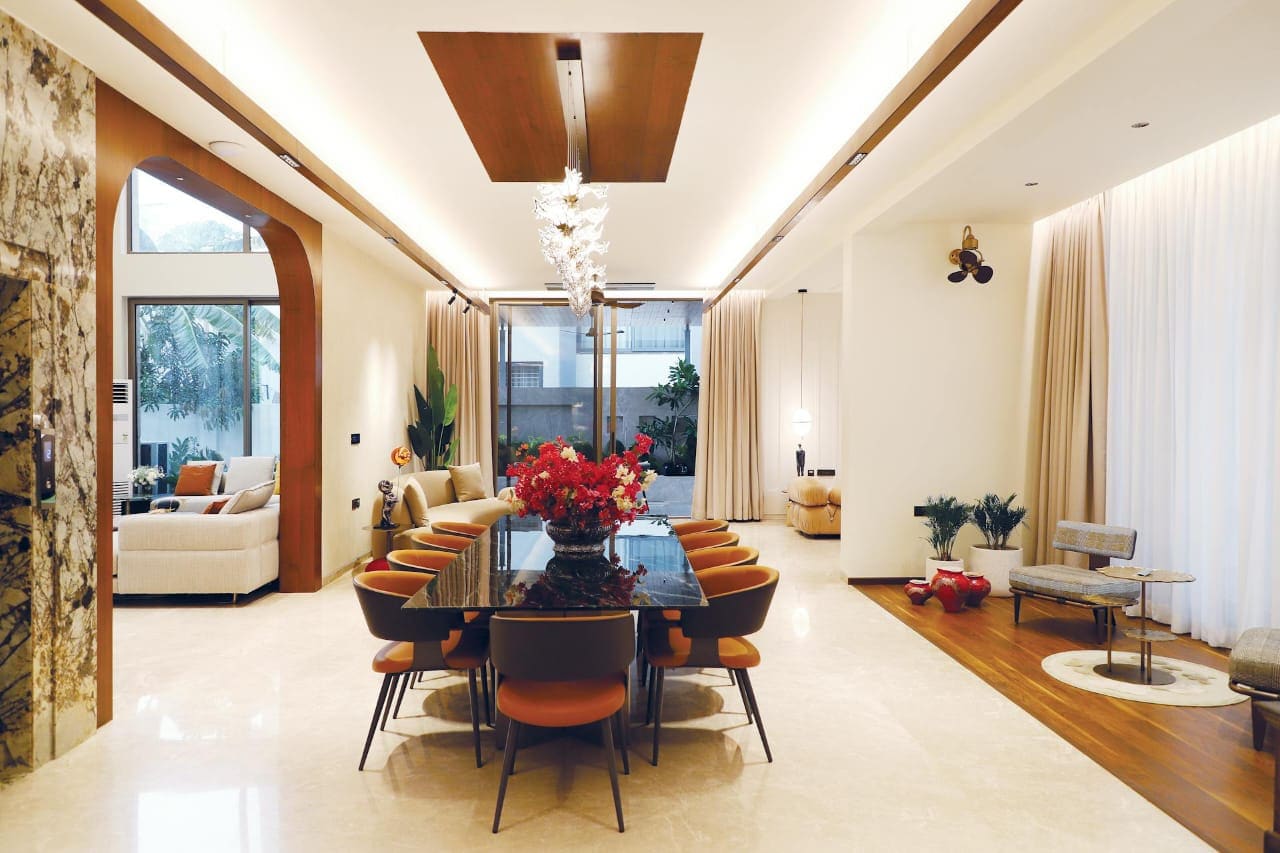 Luxury dining and living interior with precise finishing and coordinated details.