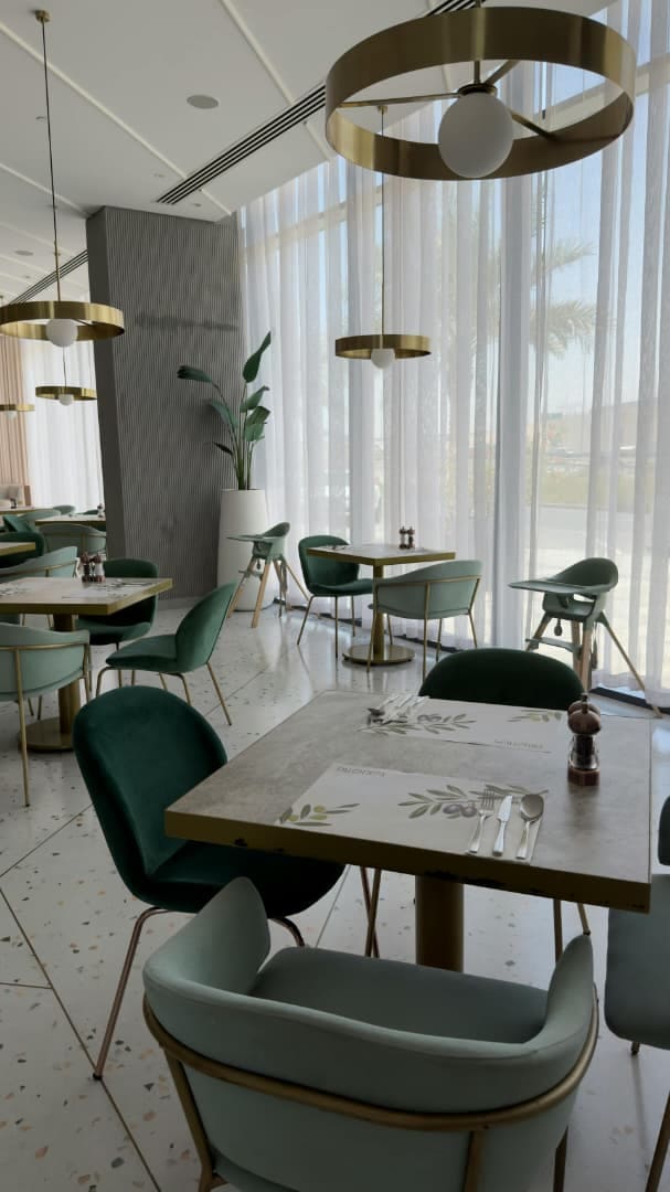Marble dining area with refined furniture and material coordination.