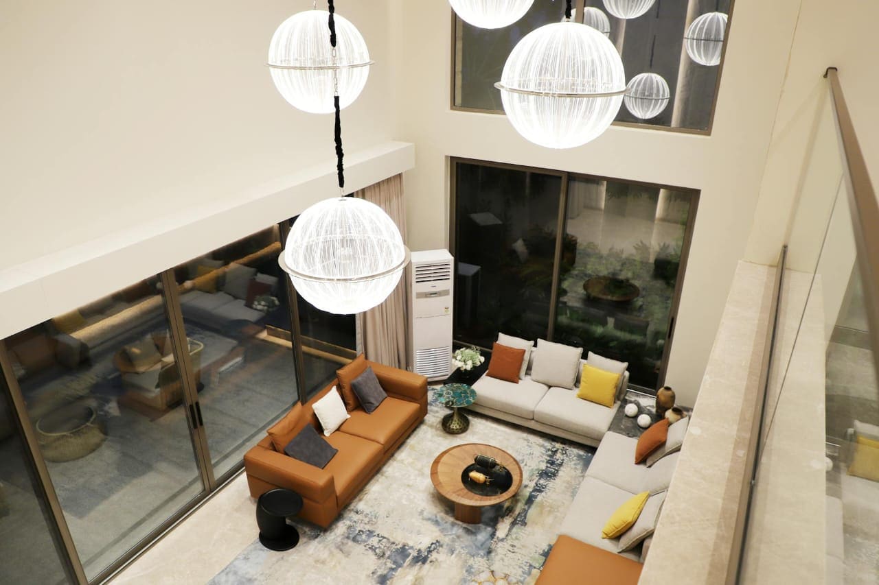 Staircase and dining interior showing spatial flow and refined concept direction.